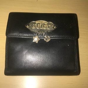 Juicy Couture black leather wallet with coin flap.